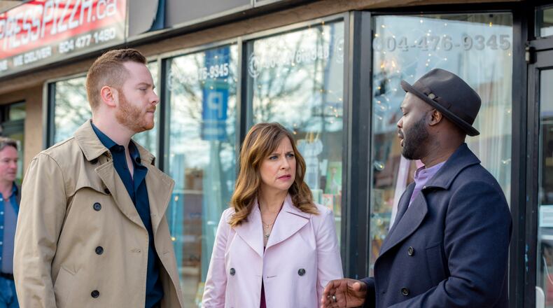 Hailey Dean, played by Kellie Martin, center, on the case with Danny (Giacomo Baessato), left, and Franklin (Doron Bell) in "Deadly Estate." Photo Credit: Crown Media/Kailey Schwerman