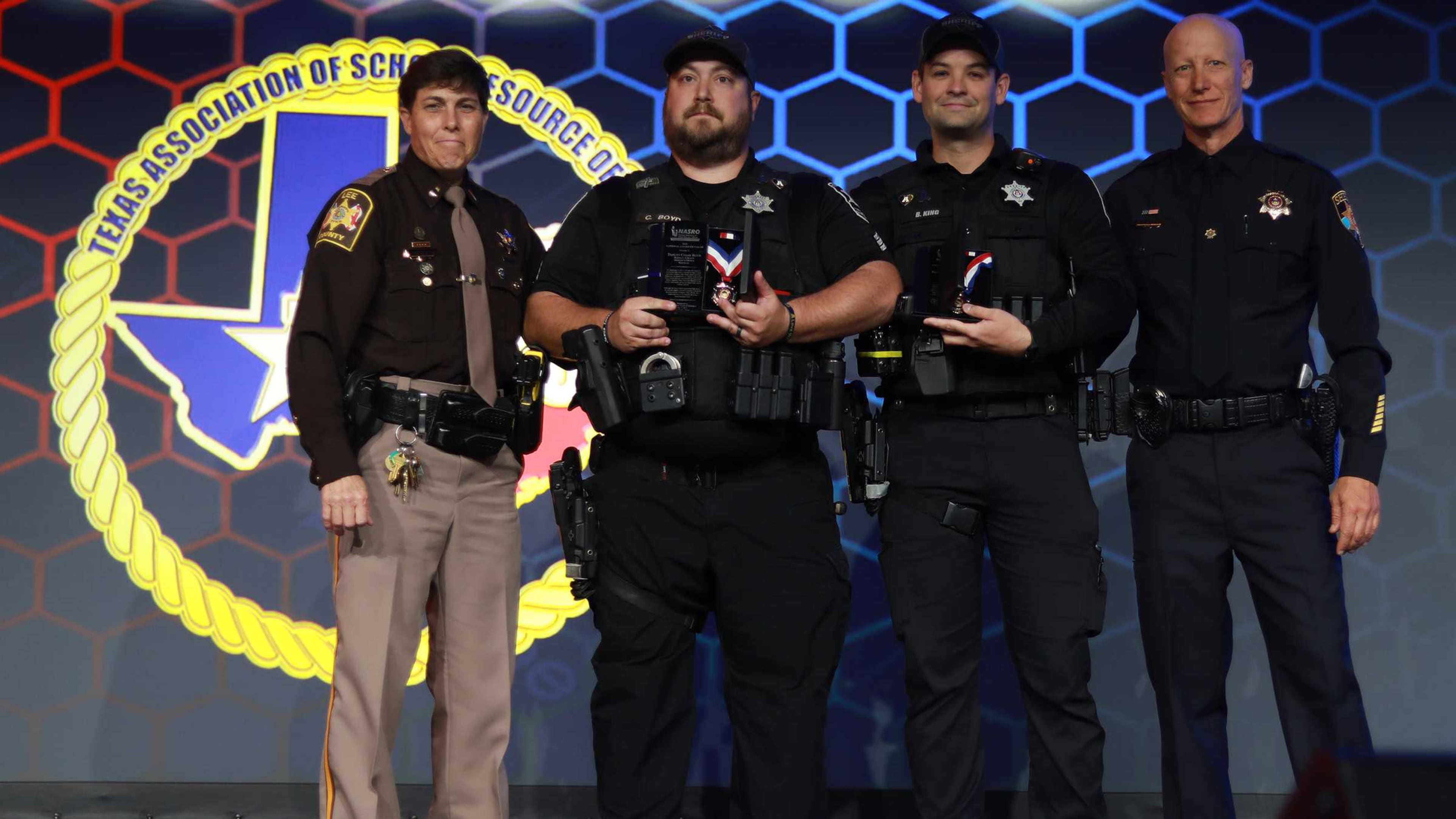 From left to right: National Association of School Resource Officers President Pam Revels, Sgt. Chase Boyd, Deputy Brandon King and NASRO Vice President James Englert. The association gave Boyd and King the National Award of Valor during its annual conference on July 7, 2025, in Grapevine, Texas. (Courtesy)