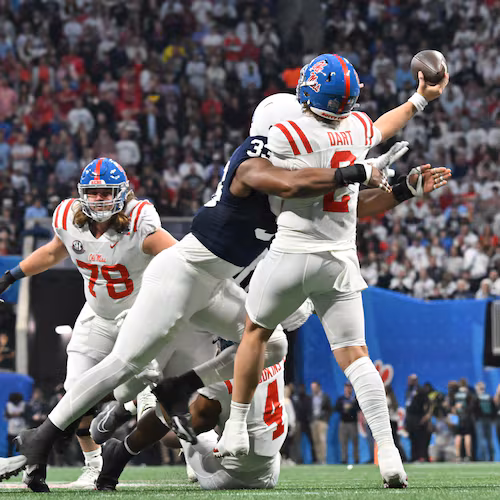 Ole Miss quarterback Jaxson Dart (2) gets tackled by Penn State defensive end Dani Dennis-Sutton (33) as he gets off a pass during the first half in 2023 Chick-fil-A Peach Bowl at Mercedes-Benz Stadium, Saturday, December 30, 2023, in Atlanta. (Hyosub Shin / Hyosub.Shin@ajc.com)