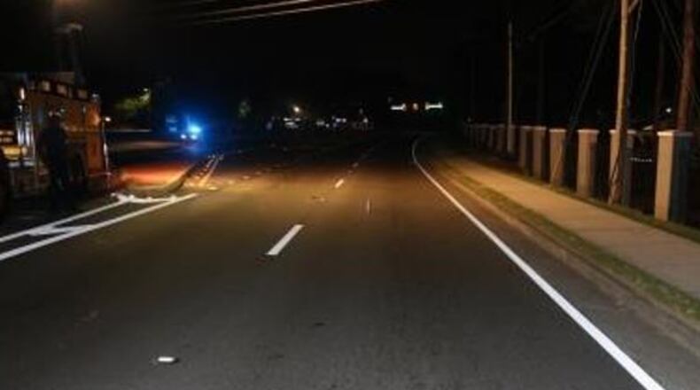 Gwinnett County police are looking for the driver of a red sedan who struck a Smyrna woman as she crossed Holcomb Bridge Road in Peachtree Corners on Monday night. The 28-year-old suffered life-threatening injuries in the collision.