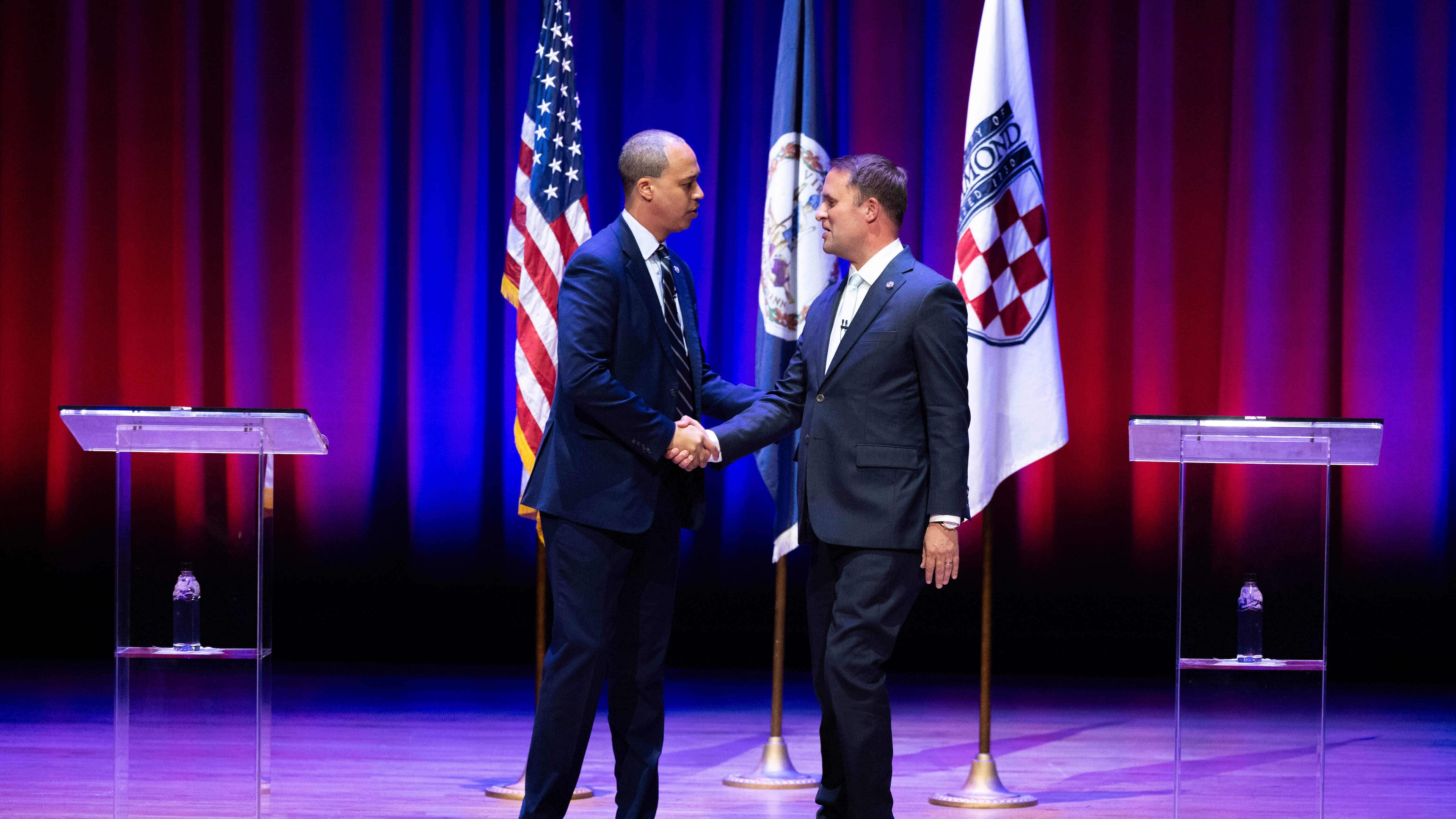 Democrat Jay Jones, left, and Republican incumbent Jason Miyares shake hands at the start of the Virginia attorney general debate in Richmond, Va., Thursday, Oct. 16, 2025. (Mike Kropf/Richmond Times-Dispatch via AP, Pool)
