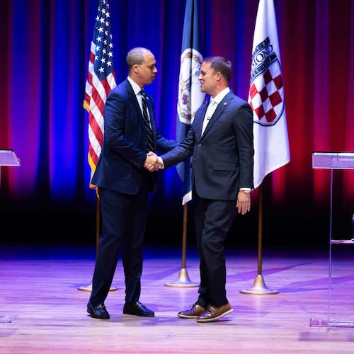 Democrat Jay Jones, left, and Republican incumbent Jason Miyares shake hands at the start of the Virginia attorney general debate in Richmond, Va., Thursday, Oct. 16, 2025. (Mike Kropf/Richmond Times-Dispatch via AP, Pool)