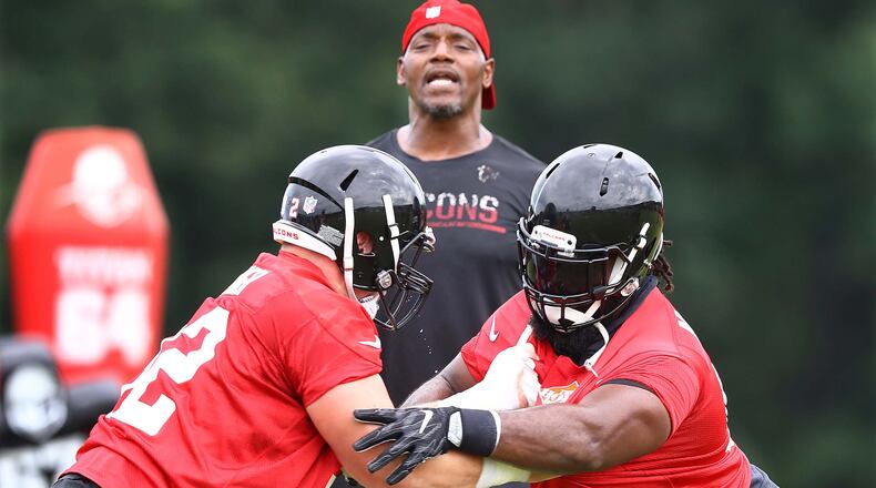 Atlanta Falcons defensive tackle Terrell McClain (right) faces off against Justin Zimmer during mandatory minicamp Thursday, June 14, 2018, in Flowery Branch.