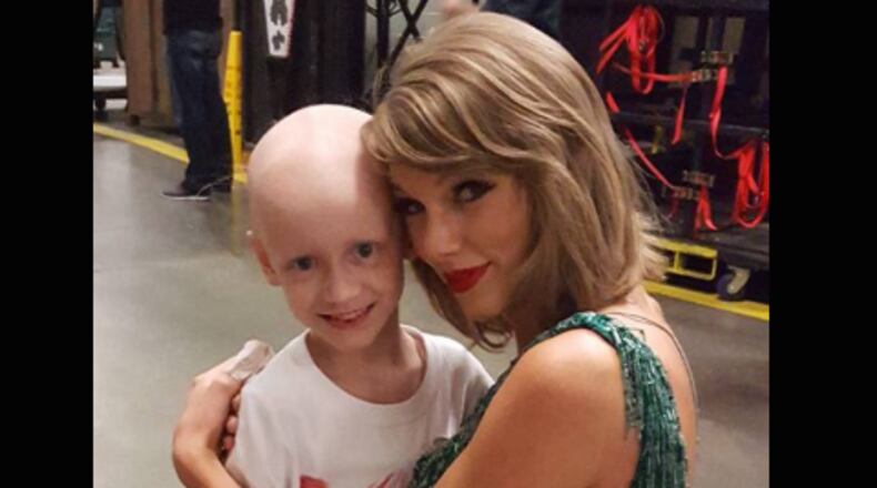 "Writing about Taylor Swift is a horrific ordeal for me because her twinkly persona is such a scary flashback to the fascist blondes who ruled the social scene during my youth,” says feminist writer Camille Paglia. Swift is shown here with a new friend, also named Taylor, before her sold-out Atlanta show.