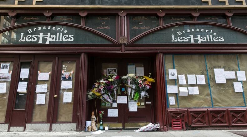 A memorial with flowers, notes, and pictures in memory for the late celebrity chef Anthony Bourdain in front of his former New York restaurant, Brasserie Les Halles, at 411 Park Ave South, in Manhattan, on Friday, June 8, 2018. (Shawn Inglima/New York Daily News/TNS)