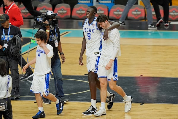 Duke's Khaman Maluach (9) and a teammate leave the court after Houston beat Duke in the national semifinals at the Final Four of the NCAA college basketball tournament, Saturday, April 5, 2025, in San Antonio. (AP Photo/Stephanie Scarbrough)