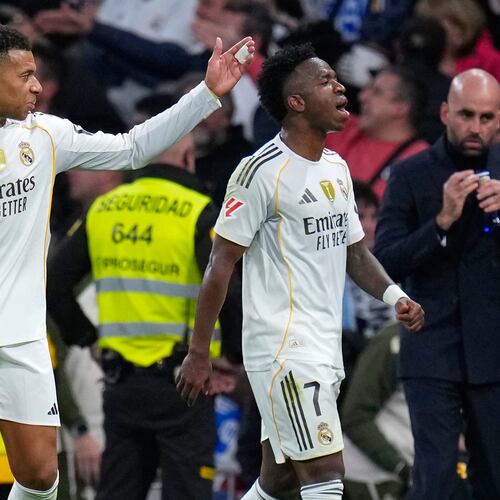 Real Madrid's Kylian Mbappe, left, and Vinicius Junior react during the Spanish La Liga soccer match between Real Madrid and Celta Vigo in Madrid, Spain, Sunday, Dec. 7, 2025. (AP Photo/Manu Fernandez)