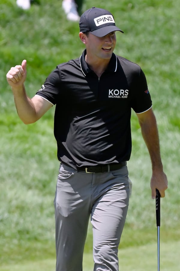 Austin Eckroat reacts after making a birdie on the 18th hole to finish the first round of the Travelers Championship golf tournament at TPC River Highlands, Thursday, June 19, 2025, in Cromwell, Conn. (AP Photo/Jessica Hill)