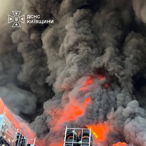 In this photo provided by the Ukrainian Emergency Service, firefighters put out a fire in a warehouse following a Russian drone attack near Kyiv, Ukraine, Saturday, Aug. 29, 2026. (Ukrainian Emergency Service via AP)