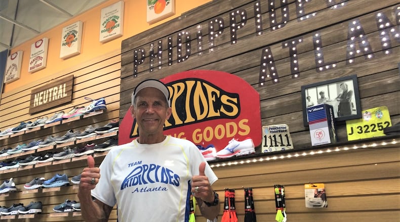 At his Atlanta store, Jeff Galloway trades in all things running and displays his mounted t-shirts from AJC Peachtree Road Races past. (Photo by Steve Hummer/AJC)