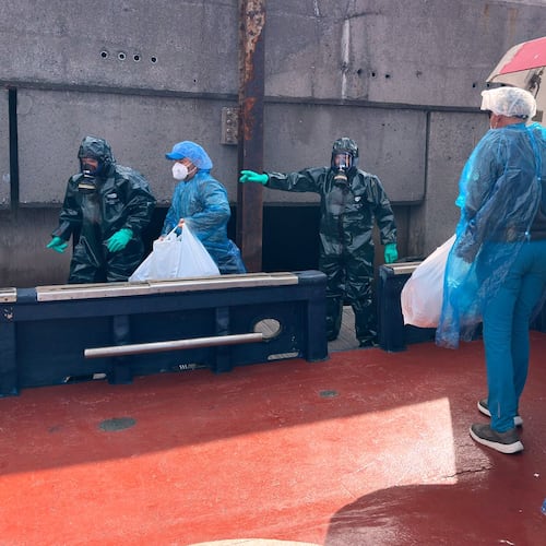 Passengers are disembarked from the hantavirus-stricken cruise ship MV Hondius at the port of Granadilla in Tenerife, Canary Islands, Spain, Sunday, May 10, 2026. (AP Photo)