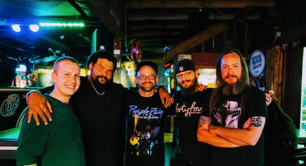 Joe Burson (left) played drums in the rock band Rusted Soul.