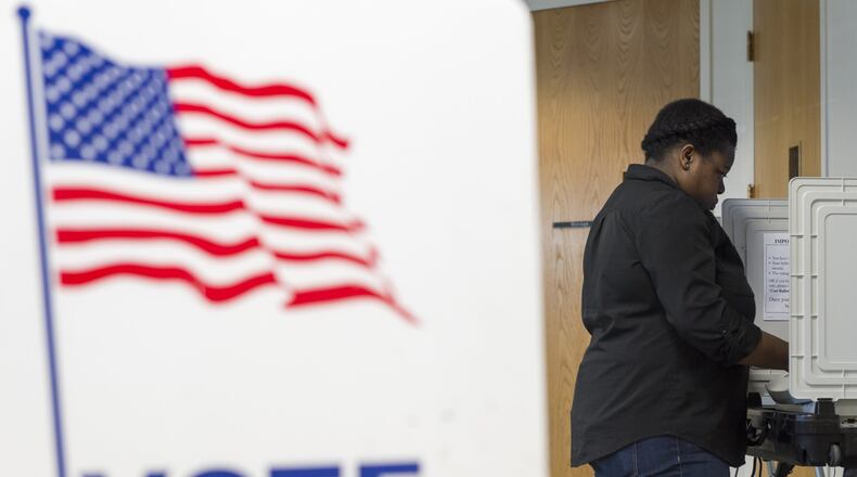 Jujuan Odom, 23, votes at a voting station at the Southwest Branch Library in Atlanta, Georgia, on Tuesday, March 21, 2017. Residents of South Fulton voted today for mayor and city council positions. (DAVID BARNES / DAVID.BARNES@AJC.COM)