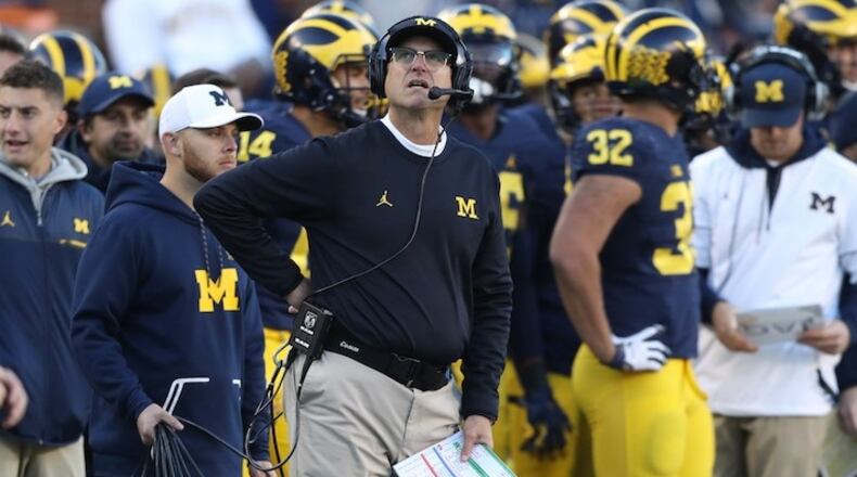 Michigan head coach Jim Harbaugh on the sidelines during action against Illinois on October 22, 2016, at Michigan Stadium in Ann Arbor, Mich. Michigan under Harbaugh is keen on Georgia when it comes to seeking recruits. (Kirthmon F. Dozier/Detroit Free Press/TNS)