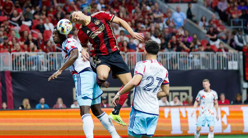 Atlanta United forward Giorgos Giakoumakis (7) disputes the ball against Chicago Fire defender Carlos Terán (4) during the first half at Mercedes-Benz Stadium on Sunday, March 31, 2024. Miguel Martinez / miguel.martinezjimenez@ajc.com
