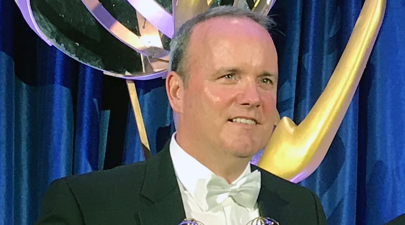 Brendan Keefe spent a lot of time on stage accepting awards, then taking photos afterwards. CREDIT: Rodney Ho/rho@ajc.com