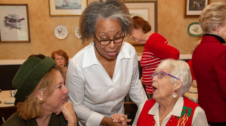 Beth Wise (from left), Charlene Pruitt and Gwen Sweitzer chats as a group of retired teachers, called the Bethesda Cardinals, from one elementary school in Gwinnett County meet for their annual luncheon at the Cottages/Payne-Corley House in Duluth.The group continues to bond together, and serve the school, years after they’ve quit teaching. Some are in their 90s. Photo by Phil Skinner