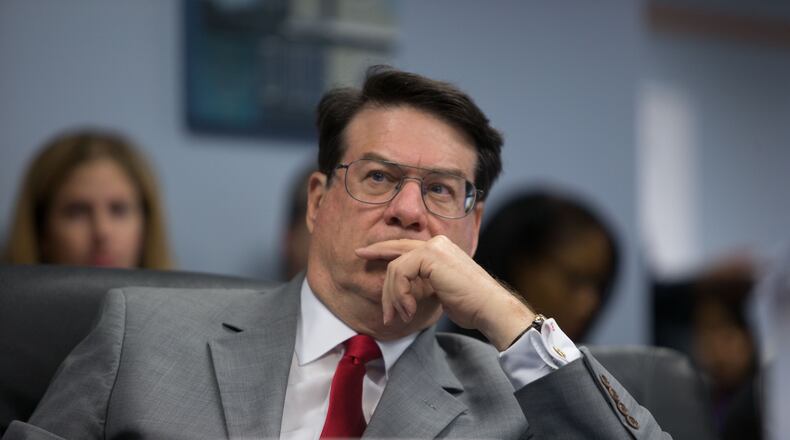 Sandy Springs Mayor Rusty Paul sits during a county meeting at the Fulton County Government Center, Monday, Dec. 14, 2015, in Atlanta.  Mayors and other representatives of Fulton County's 14 cities met to discuss a possible TSPLOST for next year.  BRANDEN CAMP/SPECIAL