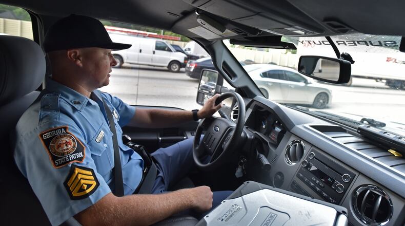 Sgt. First Class Chris Stallings monitors motorists in downtown Atlanta in this AJC file photo. Stallings has been named the new GEMA director. HYOSUB SHIN / HSHIN@AJC.COM