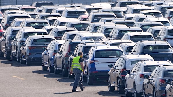 New German cars are stored at a logistic center in Duisburg, Germany, Thursday, March 27, 2025. (AP Photo/Martin Meissner)