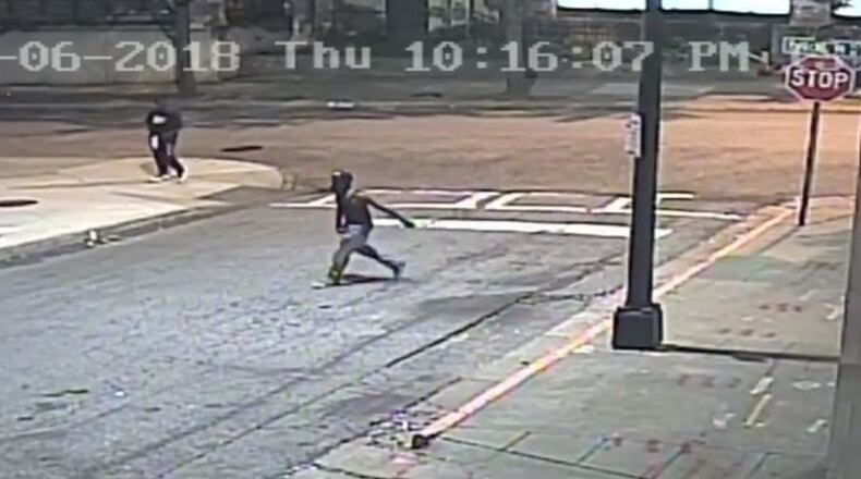 Police are searching for a person of interest in a shooting at the intersection of Peachtree Place and Cypress Street.