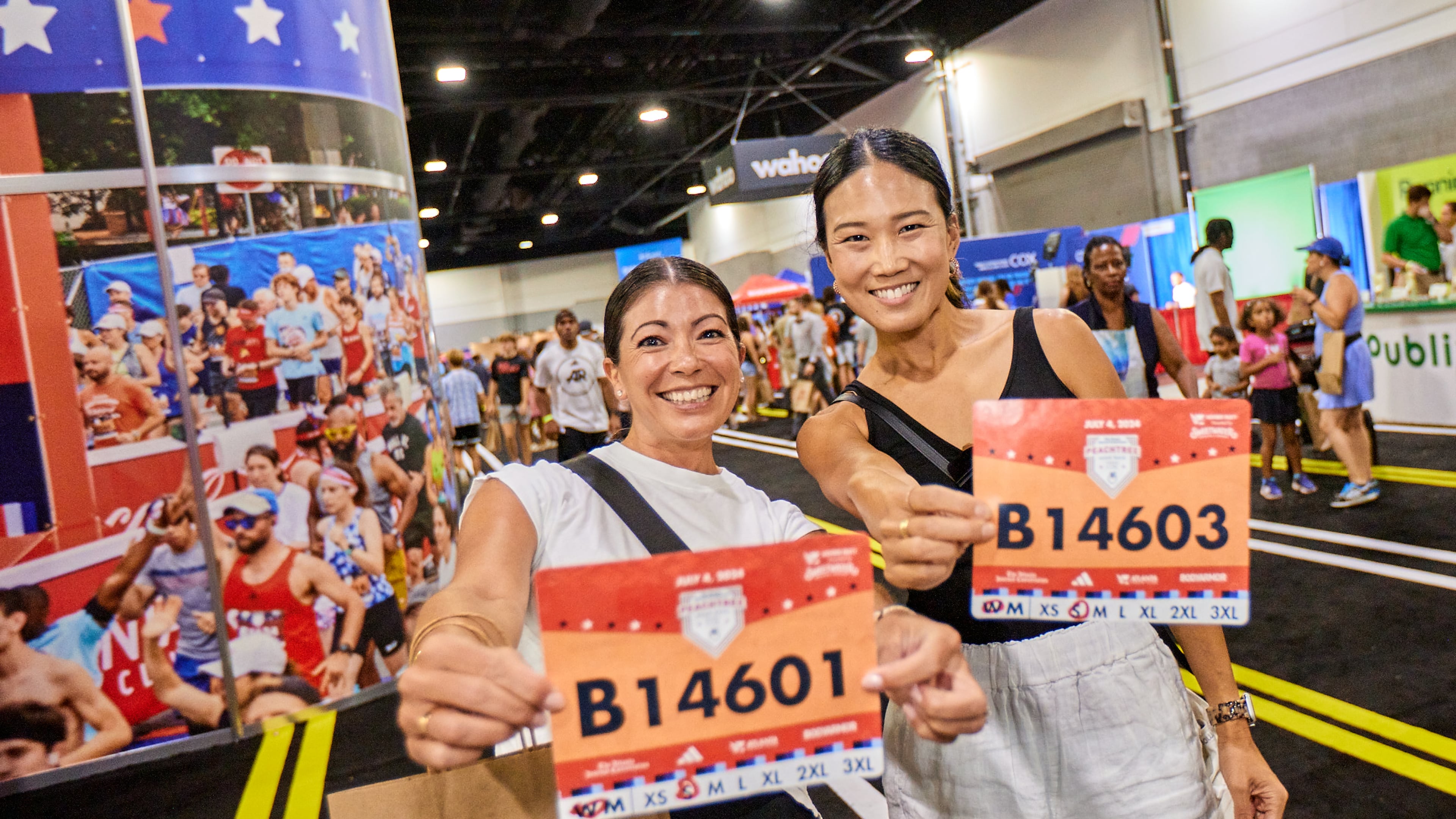 Runners pick up their bibs at the 2024 Peachtree Health and Fitness Expo at the Georgia World Congress Center in Atlanta. (Paul McPherson for Atlanta Track Club)