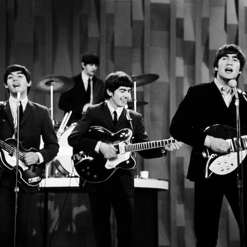 FILE - The Beatles, from left, Paul McCartney, Ringo Starr, George Harrison and John Lennon, perform for the CBS "Ed Sullivan Show" in New York, as they record a set on Feb. 9, 1964, that would be shown later on a broadcast of the show. (AP Photo/Dan Grossi, File)