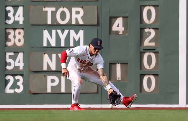 Boston Red Sox outfielder Jarren Duran fields the ball during the seventh inning of a baseball game against the St. Louis Cardinals, Friday, April 4, 2025, in Boston. (AP Photo/Mark Stockwell)