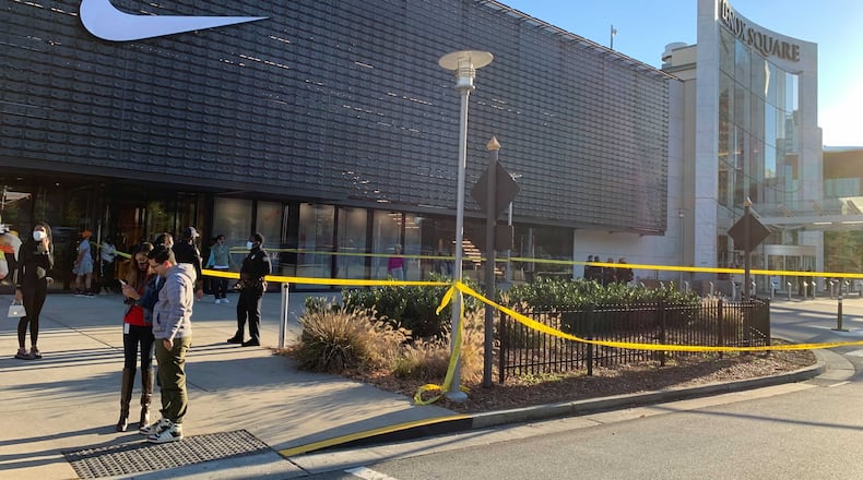 Atlanta police are investigating after a fight inside the new Apple store at Lenox Square escalated into a shooting that sent a man to the hospital Friday afternoon.