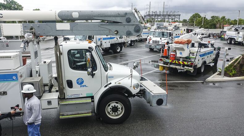 FPL crews gather at a Jupiter substation Wednesday morning, Oct. 10, 2018, before leaving for North Florida to help restore power after Category-4 Hurricane Michael hits the area. The ten 2-3 person crews will join more than 1,300 crews from across Florida staging in Lake City, Daytona Beach and Sarasota. (Lannis Waters / The Palm Beach Post)