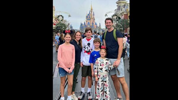 Beth Collums (second from left) and her family pose for a picture during a trip to Disney World in December. (Courtesy of Beth Collums)