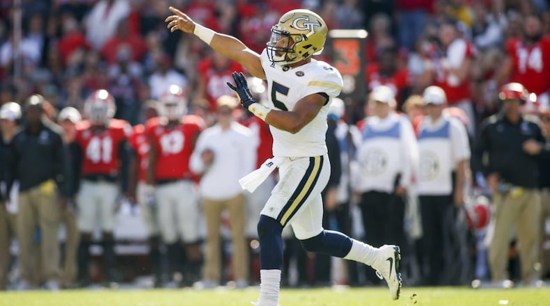 Georgia Tech quarterback Justin Thomas led the Yellow Jackets to touchdowns on their final two drives to escape a 13-point fourth-quarter deficit and win 28-27 over Georgia. (Associated Press)