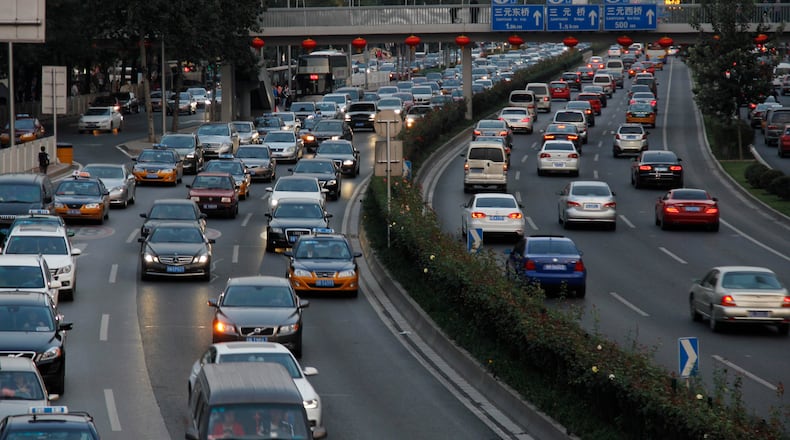 BEIJING, CHINA - SEPTEMBER 30: (CHINA OUT) A traffic jam appears during the upcoming National Day of the People's Republic of China on September 30, 2014 in Beijing, China. Traffic jams appeared in most cities of China due to the growing number of travelling and family-visiting people during the upcoming National Day of the People's Republic of China. (Photo by ChinaFotoPress/ChinaFotoPress via Getty Images)