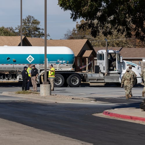 Crews begin checking the Airgas tanker on Thursday, Nov. 13, 2025 that leaked in the parking lot of the Holiday Inn Express in Weatherford, Okla. the previous night and caused mandatory evacuations. (AP Photo/Alonzo Adams)