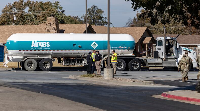 Crews begin checking the Airgas tanker on Thursday, Nov. 13, 2025 that leaked in the parking lot of the Holiday Inn Express in Weatherford, Okla. the previous night and caused mandatory evacuations. (AP Photo/Alonzo Adams)