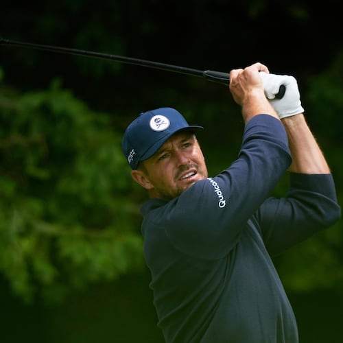 Bryson DeChambeau watches his tee shot on the fourth hole during the first round of the PGA Championship golf tournament practice round at Aronimink Golf Club, Thursday, May 14, 2026, in Newtown Square, PA. (AP Photo/Matt Slocum)