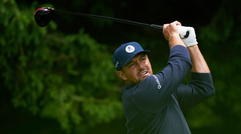 Bryson DeChambeau watches his tee shot on the fourth hole during the first round of the PGA Championship golf tournament practice round at Aronimink Golf Club, Thursday, May 14, 2026, in Newtown Square, PA. (AP Photo/Matt Slocum)