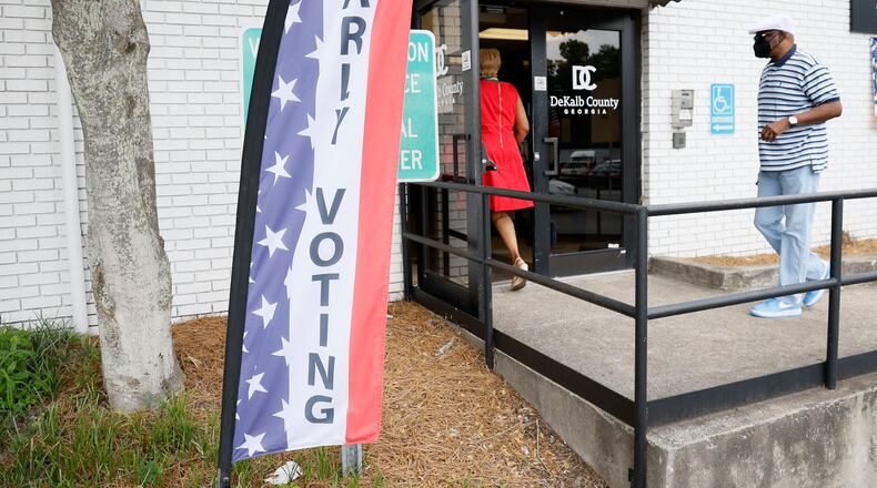 People walk through the entrance at the Voter Registration & Elections in Dekalb County, Georgia, during the first day of early voting on June 13, 2022. (Miguel Martinez/The Atlanta Journal-Constitution/TNS)