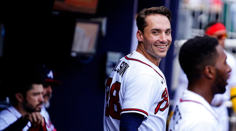 Atlanta Braves' Matt Olson (28) celebrates in the dugout after a home run in the first inning of a baseball game against the San Diego Padres, Saturday, May 14, 2022, in Atlanta. (AP Photo/Brynn Anderson)