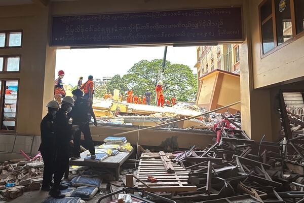 Rescuers work at U Hla Thein Buddhist monastery that collapsed in Friday's earthquake in Mandalay, Myanmar, Monday, March 31, 2025. (AP Photo/Thein Zaw)