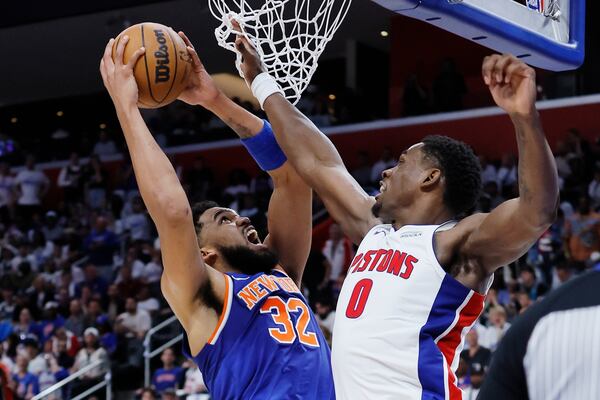 New York Knicks center Karl-Anthony Towns (32) goes to the basket against Detroit Pistons center Jalen Duren (0) during the first half of Game 3 of an NBA basketball first-round playoff series Thursday, April 24, 2025, in Detroit. (AP Photo/Duane Burleson)