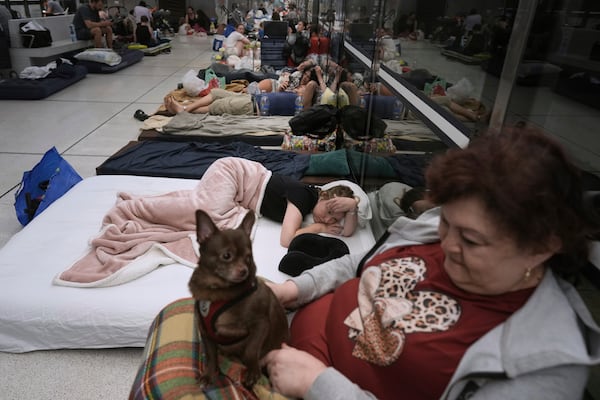 People take shelter in an underground metro station in prevention of Iran missile attacks, in Ramat Gan, near Tel Aviv, Israel, Tuesday, June 17, 2025. (AP Photo/Oded Balilty)