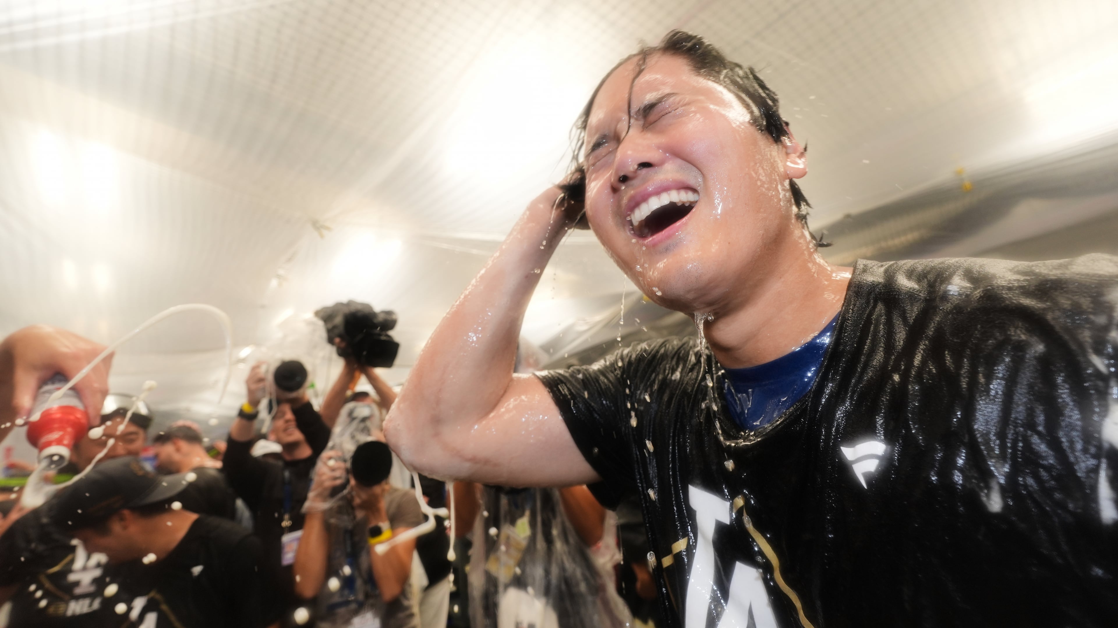Los Angeles Dodgers' Shohei Ohtani celebrates after his team's win over the Philadelphia Phillies in Game 4 of baseball's National League Division Series Thursday, Oct. 9, 2025, in Los Angeles. (AP Photo/Jae C. Hong)