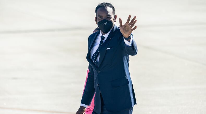 Atlanta Mayor Andre Dickens and his daughter Bailey Dickens depart Hartsfield-Jackson International Airport in Atlanta, Georgia on January 11th, 2022 after welcoming the President and Vice President to the city. (Nathan Posner for The Atlanta Journal-Constitution)