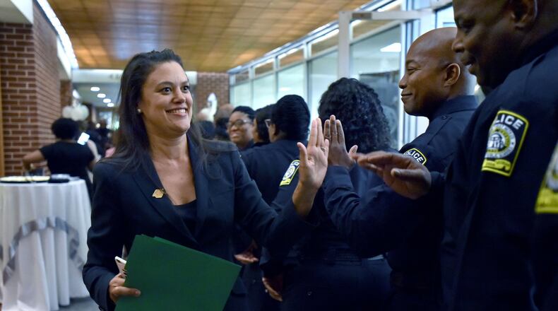Atlanta Public Schools Superintendent Meria Carstarphen high fives Atlanta school district police department members before a swearing-in ceremony on Thursday, June 23, 2016. AJC FILE PHOTO HYOSUB SHIN / HSHIN@AJC.COM