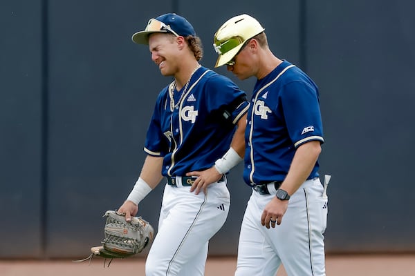 Georgia Tech head coach James Ramsey (right) consoles star Drew Burress after their season-ending loss to Oklahoma. (Erik S. Lesser for the AJC)