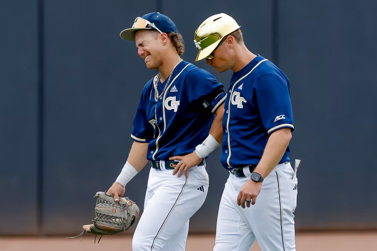 Georgia Tech head coach James Ramsey, right, consoles Drew Burress (8), after Oklahoma hit a solo home run against Tech during the 10th inning to win the NCAA D1 Atlanta Regional elimination baseball game at Russ Chandler Stadium, Monday, June 1, 2026, in Atlanta. (Erik S. Lesser for the AJC)