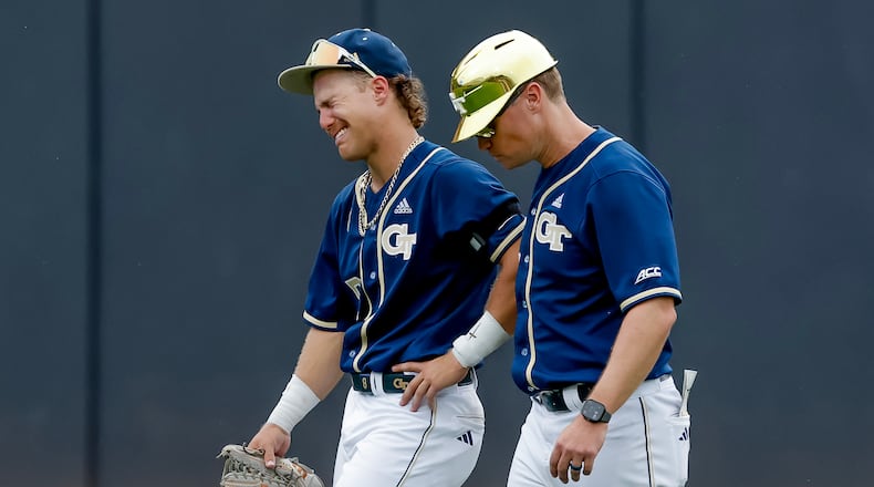Georgia Tech head coach James Ramsey, right, consoles Drew Burress (8), after Oklahoma hit a solo home run against Tech during the 10th inning to win the NCAA D1 Atlanta Regional elimination baseball game at Russ Chandler Stadium, Monday, June 1, 2026, in Atlanta. (Erik S. Lesser for the AJC)