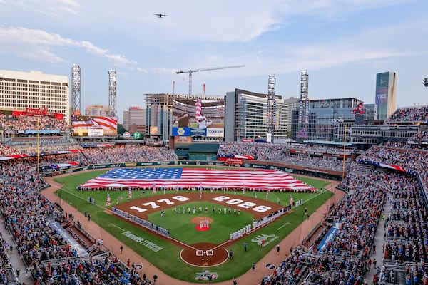 A Lockheed C-130H performs a flyover before the Braves and Mets clashed at Truist Park on July Fourth. (Erik S. Lesser/AP)