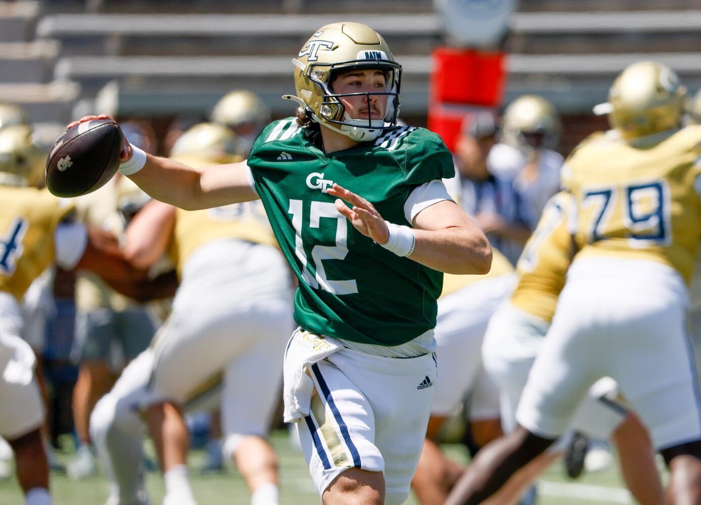 Quarterback Aaron Philo rolls out during Georgia Tech football team's annual White and Gold game in Atlanta on Saturday, April 12, 2025.  Players split into two teams — Team Swarm and Team Wreck ‘Em — with some players being asked to play on both squads.  (Bob Andres for the Atlanta Journal Constitution)